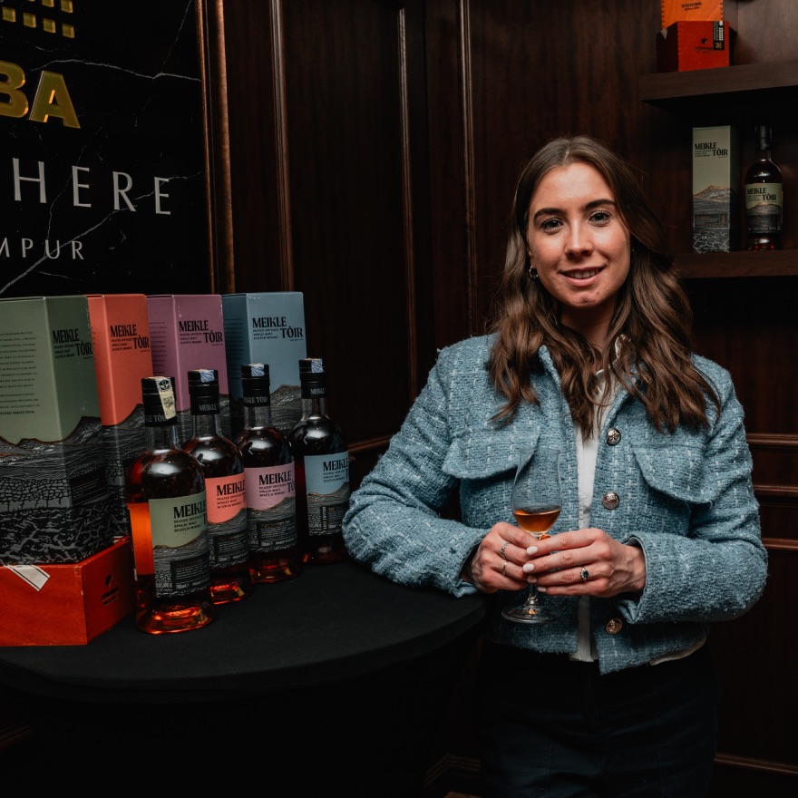 Ciara Hepburn, International Sales Manager, GlenAllachie standing beside Meikle Toir range